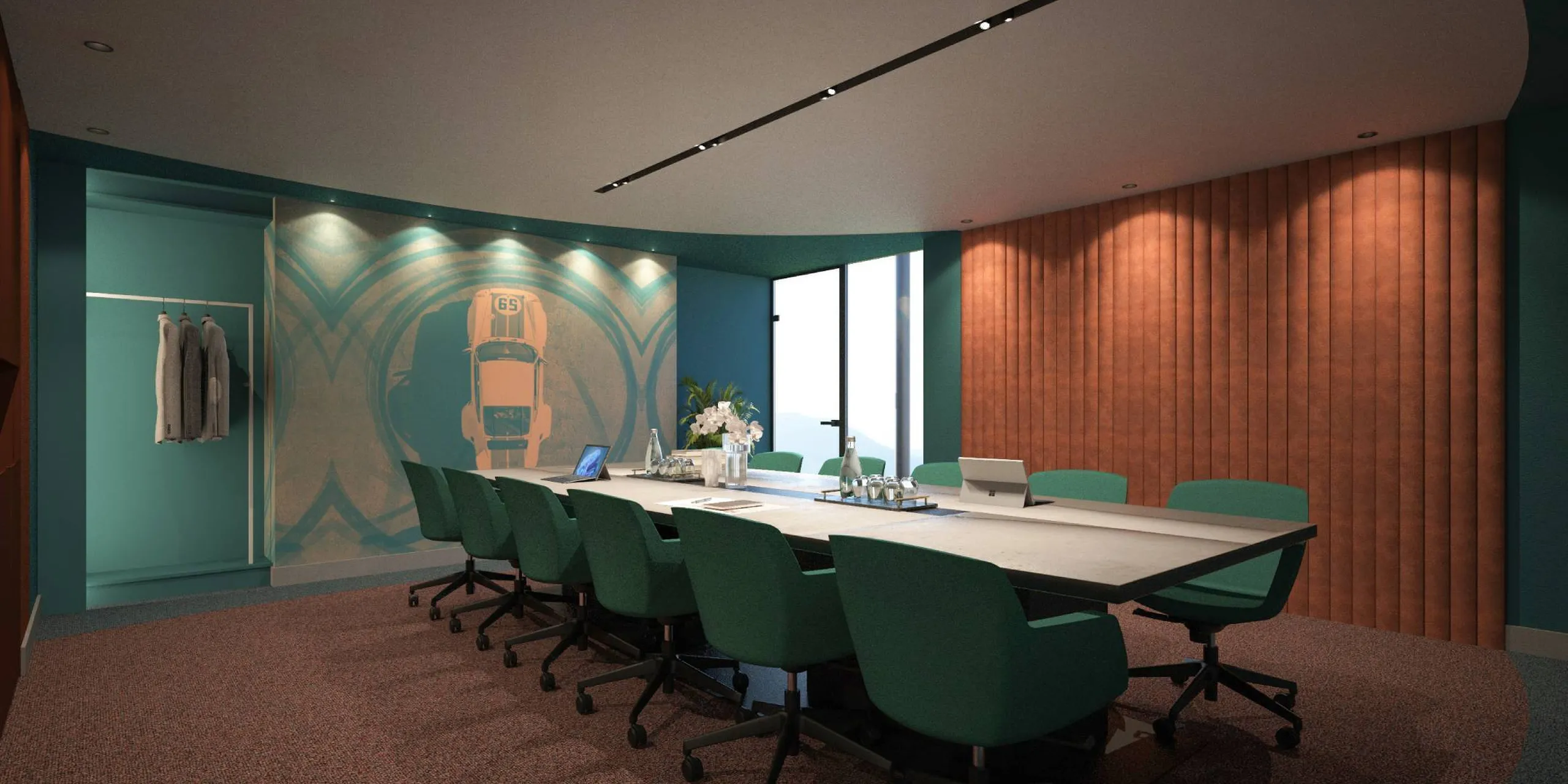 Sala riunioni con tavolo lungo e sedie verde smeraldo, pareti azzurre, rivestimento in legno a listelli e murale con auto d’epoca sullo sfondo.